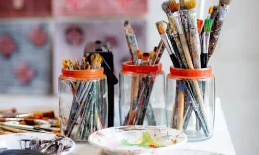white ceramic plate with paint brushes and paint brushes