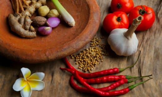 round brown clay bowl with vegetables