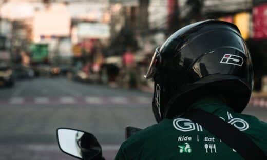 man in green and black jacket wearing black helmet