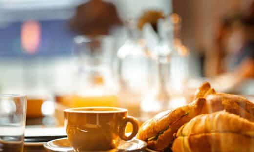 a plate of croissants and a cup of coffee