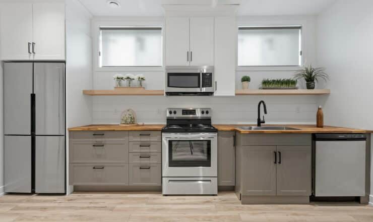 a kitchen with white cabinets