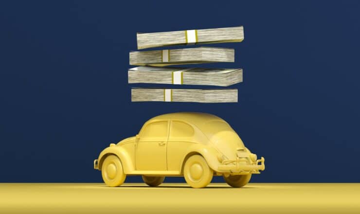 a yellow car with stacks of money on top of it