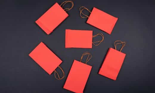 orange paper clip on black surface