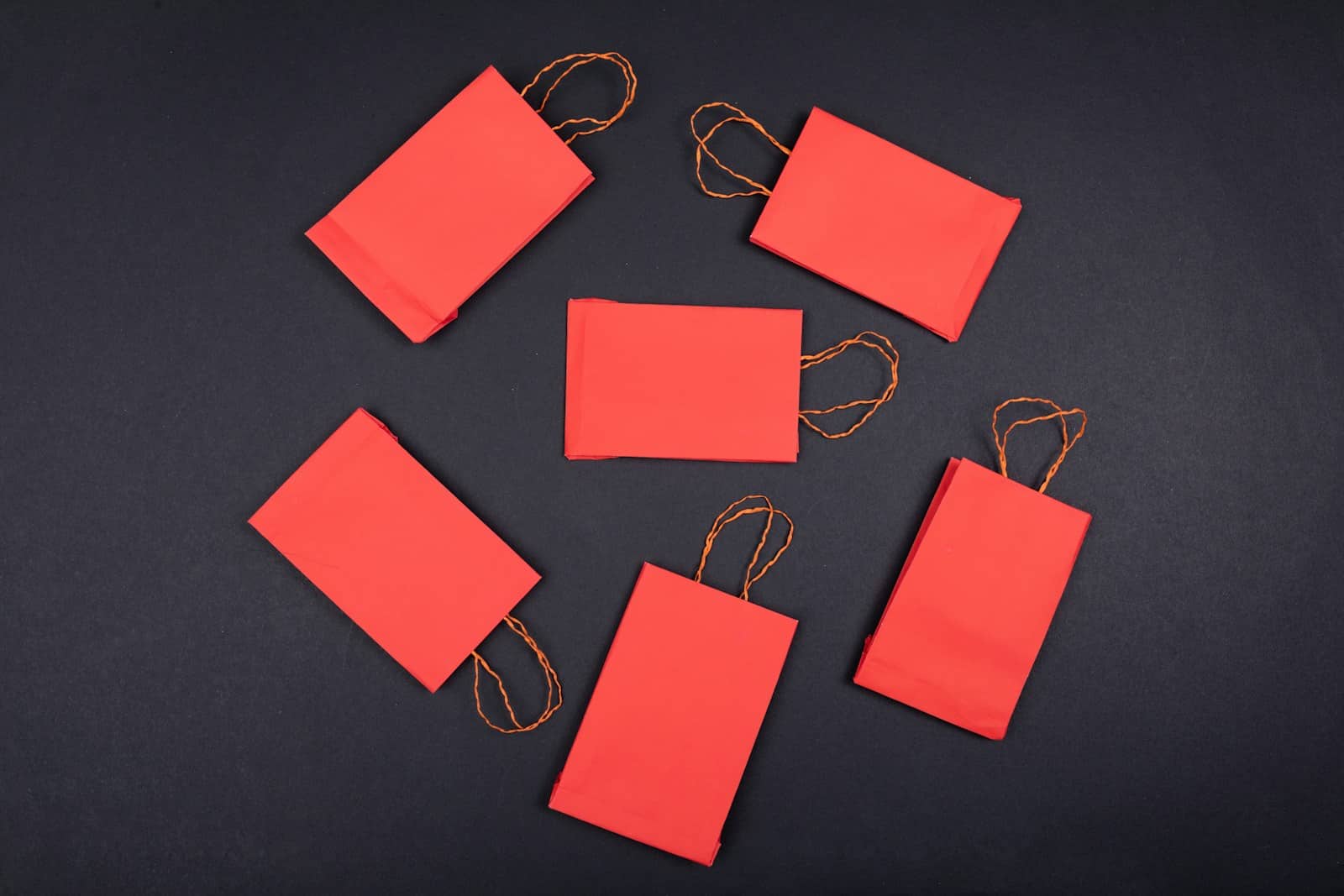 orange paper clip on black surface