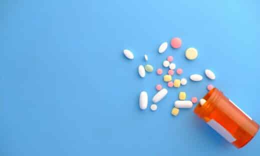 orange and white medication pill