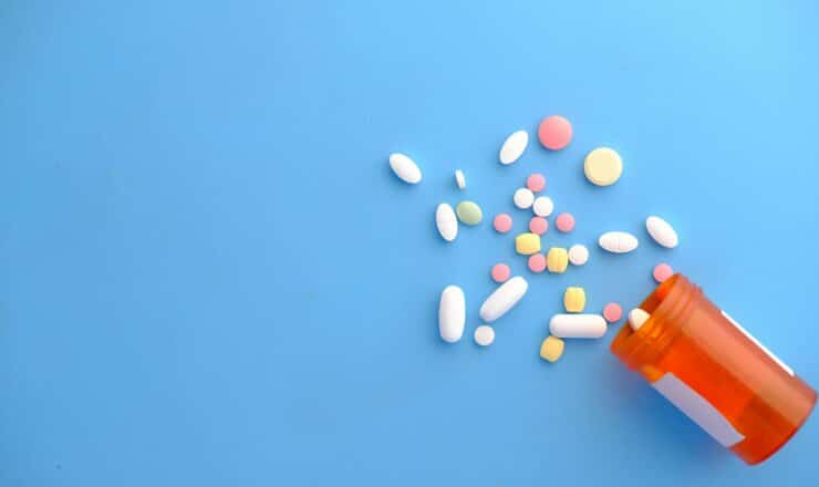 orange and white medication pill