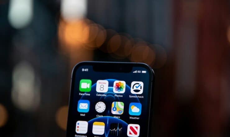 black iphone 4 displaying icons