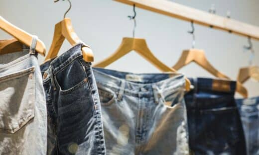 selective focus photography of hanged denim jeans