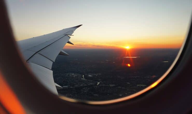 airplanes window view of sky during golden hour