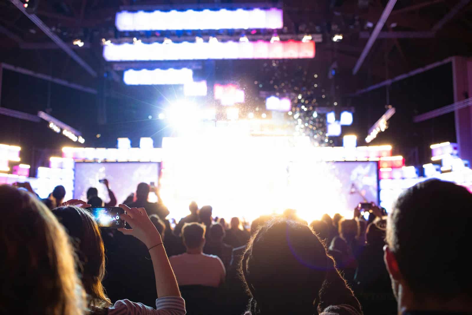 people watching band on stage