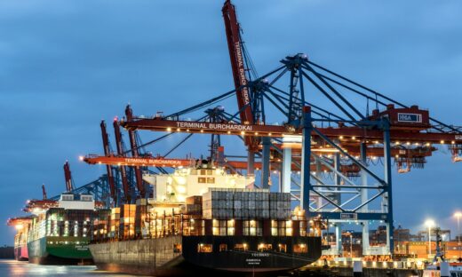 a large cargo ship docked at a dock